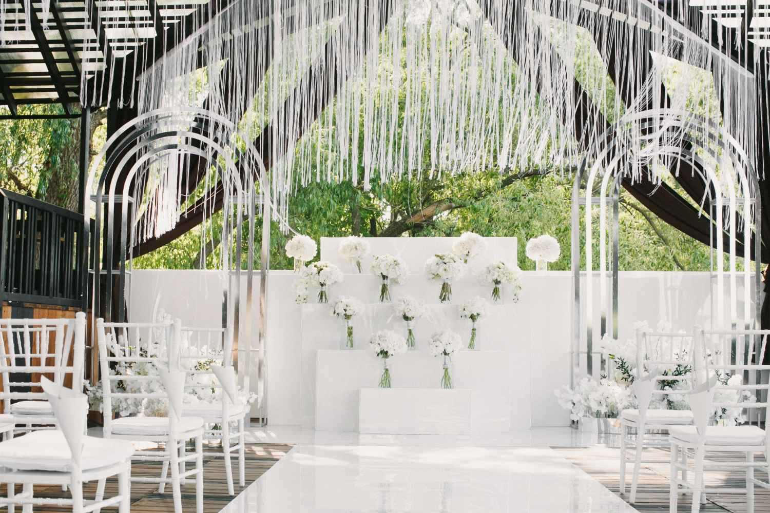 white wedding decorated with flowers 11zon 1